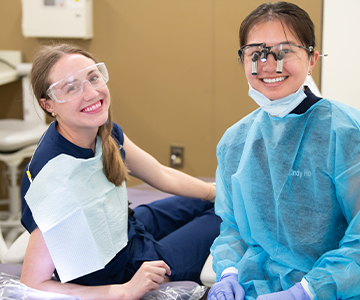 Two medical professionals smiling together. Links to Gifts of Cash, Checks, and Credit Cards Two medical professionals smiling together. Links to Gifts of Cash, Checks, and Credit Cards